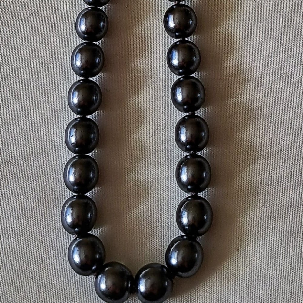 Gray Faux pearl necklace.